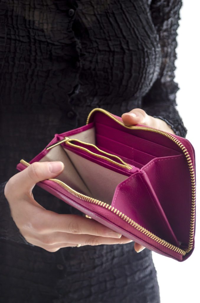 Woman holding an empty wallet